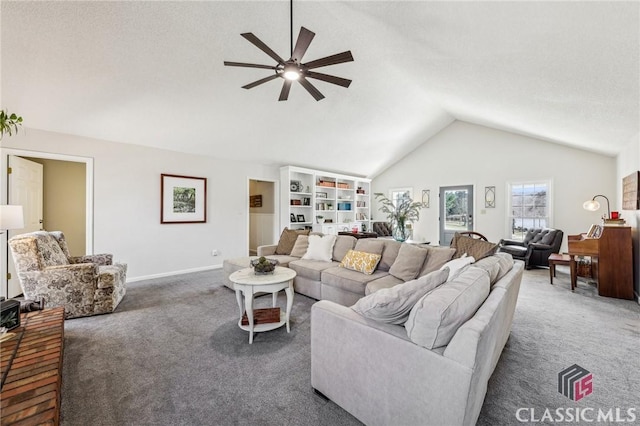 living room featuring a ceiling fan, dark colored carpet, lofted ceiling, and baseboards