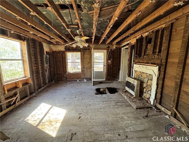 unfurnished living room featuring heating unit