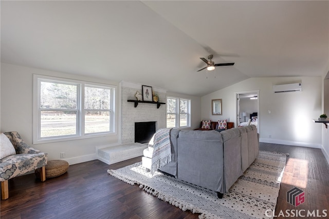 living room with lofted ceiling, a large fireplace, dark wood-style flooring, and a wall mounted AC