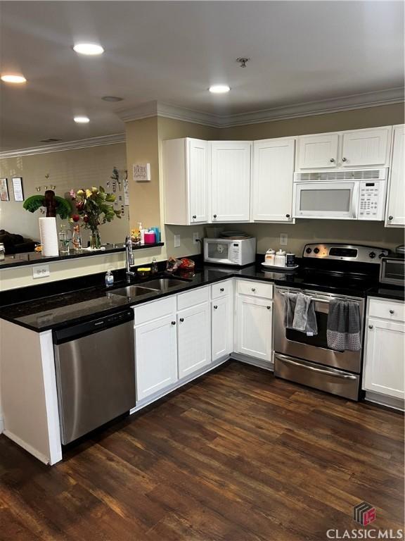 kitchen with stainless steel appliances and white cabinets