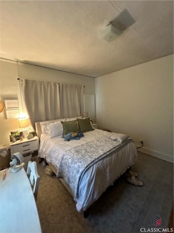 bedroom featuring baseboards