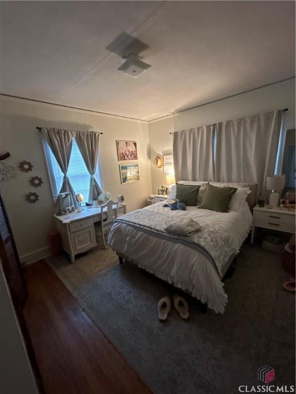 bedroom with wood finished floors