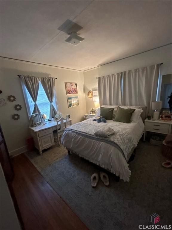 bedroom with dark wood-style floors