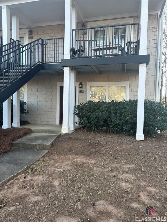 view of property exterior featuring stairs