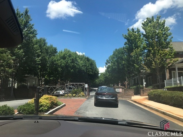 view of road with sidewalks and curbs