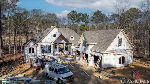 view of front of house with a shingled roof