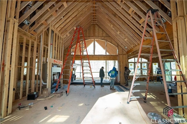 miscellaneous room featuring high vaulted ceiling