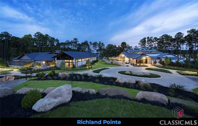 exterior space with driveway and a front lawn