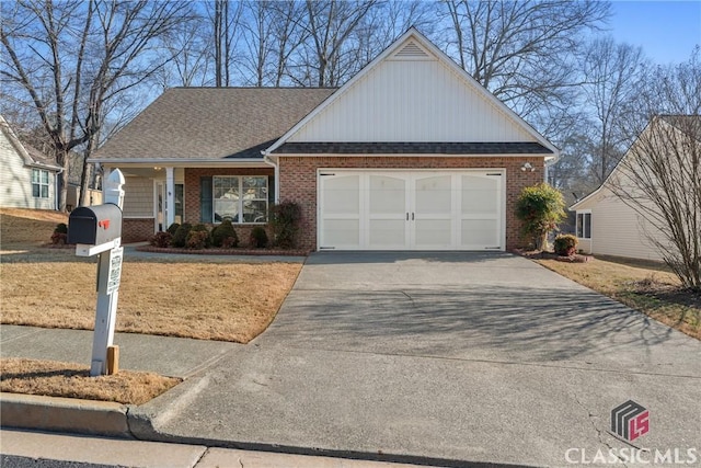 view of front facade featuring a shingled roof, concrete driveway, brick siding, and an attached garage