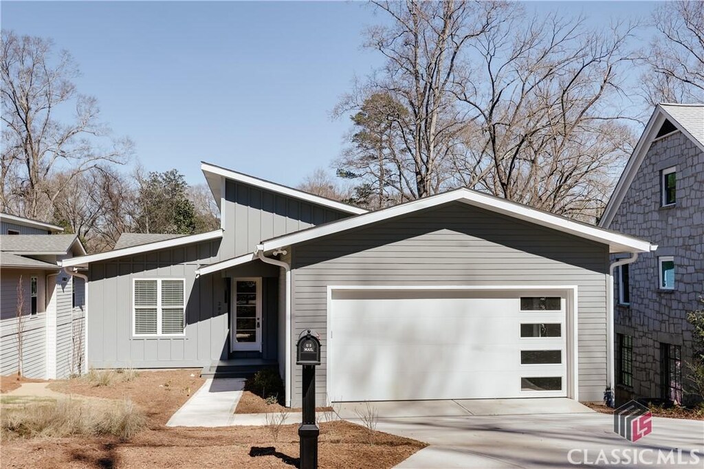 286 Hodgson Dr, Athens, GA 30606 - view of front of home with a garage, driveway, and board and batten siding