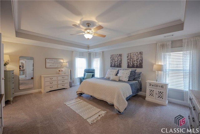 bedroom with carpet, a raised ceiling, and crown molding