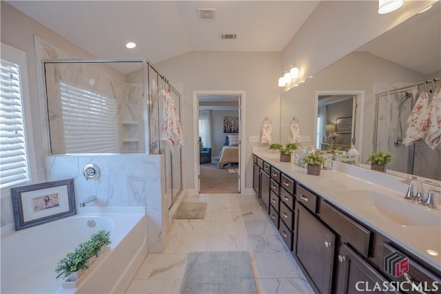 full bathroom featuring lofted ceiling, visible vents, ensuite bathroom, a stall shower, and a sink