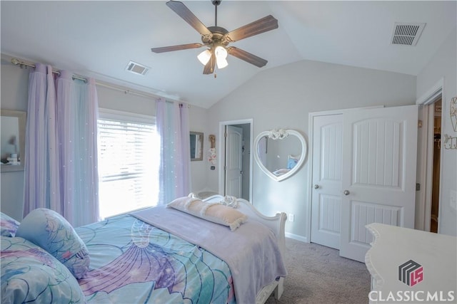 carpeted bedroom with lofted ceiling, ceiling fan, and visible vents