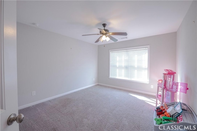 rec room featuring ceiling fan, carpet floors, visible vents, and baseboards