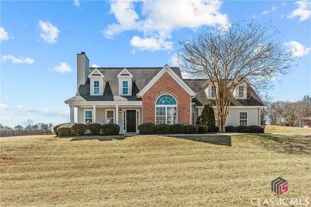 new england style home featuring a front lawn and a chimney