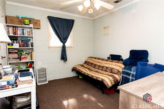 carpeted bedroom with ornamental molding, concrete block wall, and a ceiling fan