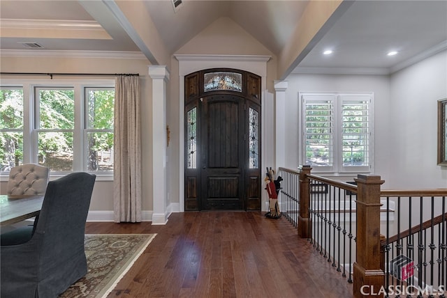 entrance foyer with crown molding, visible vents, hardwood / wood-style flooring, and a healthy amount of sunlight