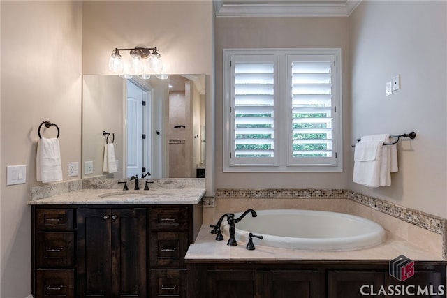 bathroom featuring a garden tub, ornamental molding, and vanity