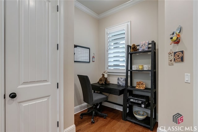 office area with baseboards, wood finished floors, and crown molding