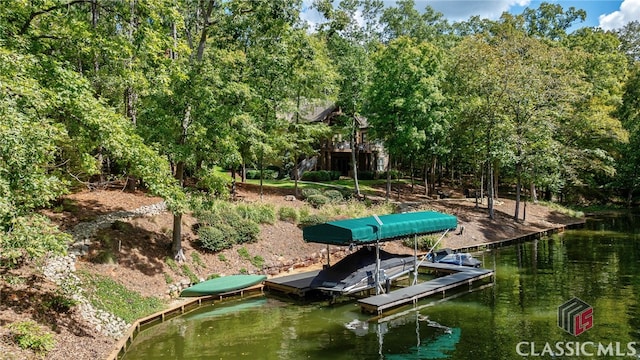 view of dock with a water view and boat lift