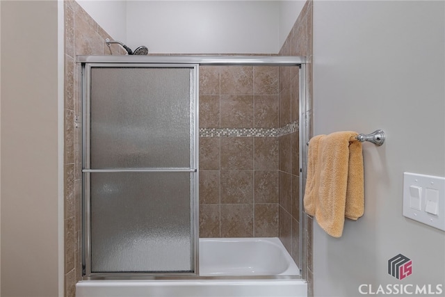 full bathroom featuring shower / bath combination with glass door