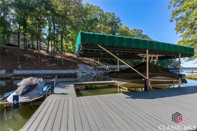 dock area featuring a water view and boat lift