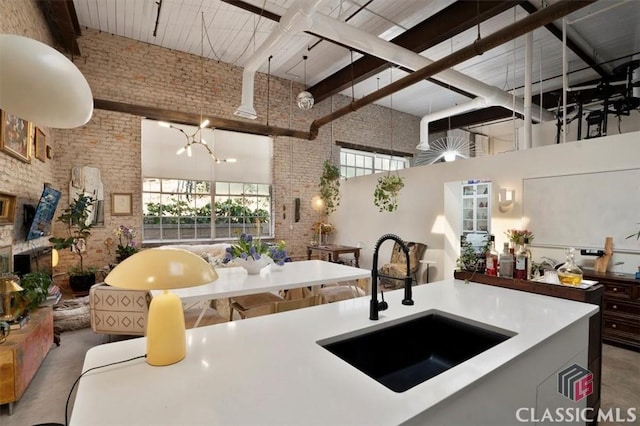 kitchen featuring premium range hood, concrete floors, a sink, light countertops, and open shelves