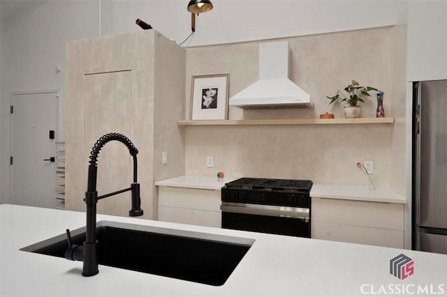 kitchen with freestanding refrigerator, a sink, custom exhaust hood, light countertops, and beam ceiling