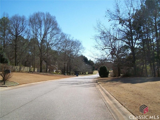 view of street featuring curbs