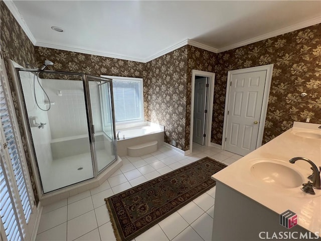 bathroom with a garden tub, a stall shower, a sink, and wallpapered walls