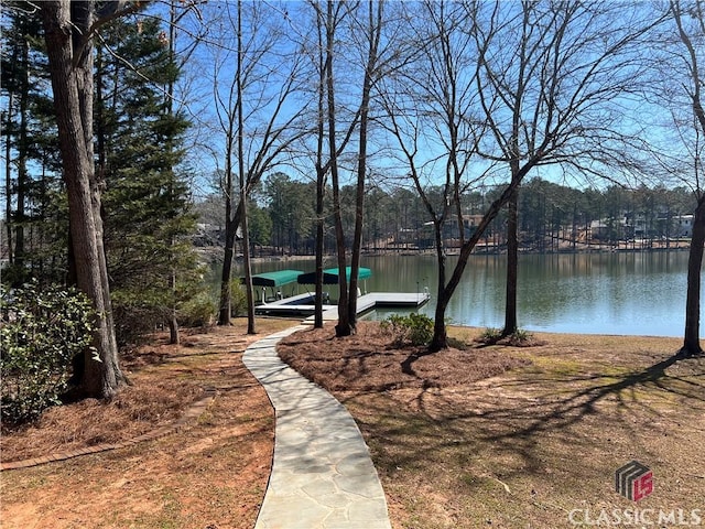 view of community featuring a dock and a water view