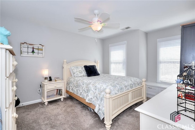 bedroom with baseboards, ceiling fan, visible vents, and carpet flooring