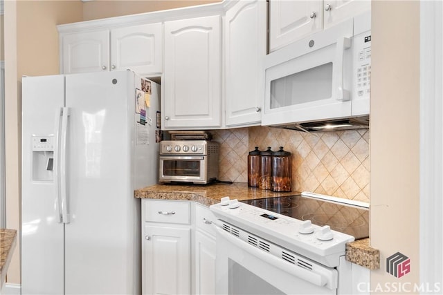 kitchen with decorative backsplash, white cabinets, and white appliances
