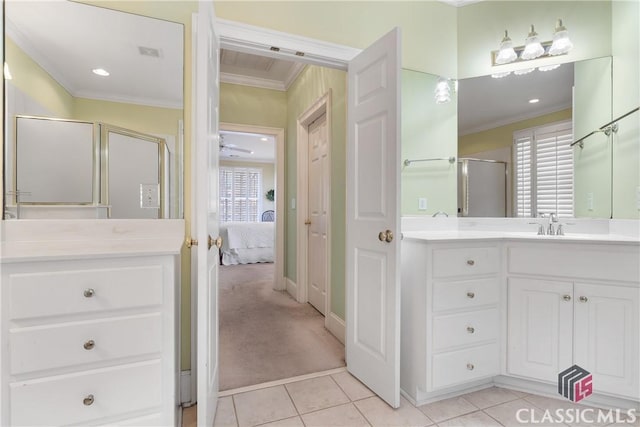 full bath with vanity, ornamental molding, a stall shower, and tile patterned floors