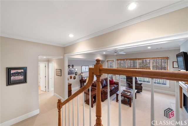 corridor featuring light colored carpet, baseboards, an upstairs landing, ornamental molding, and recessed lighting