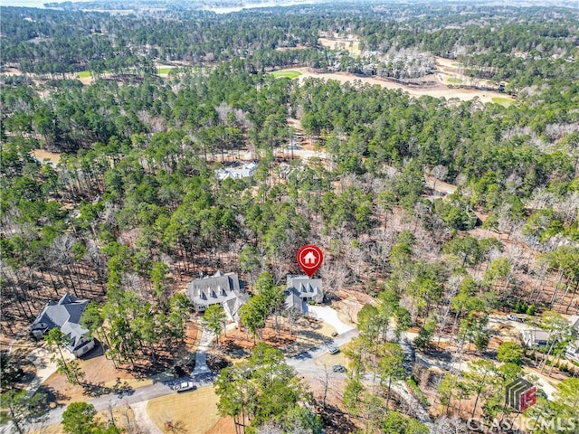 bird's eye view featuring a forest view