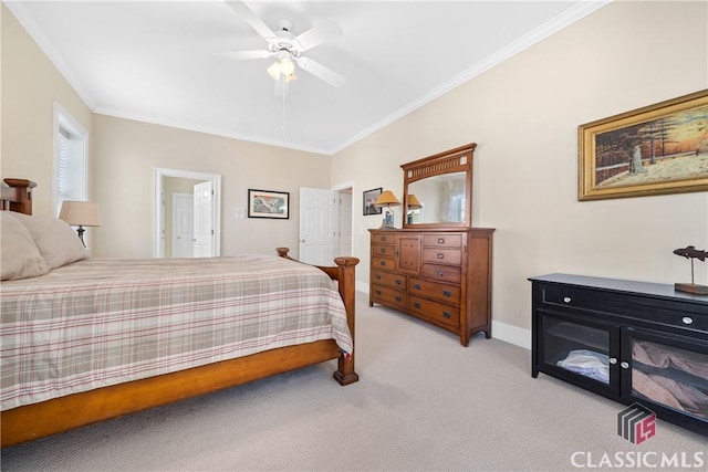 bedroom featuring light colored carpet, ornamental molding, baseboards, and a ceiling fan