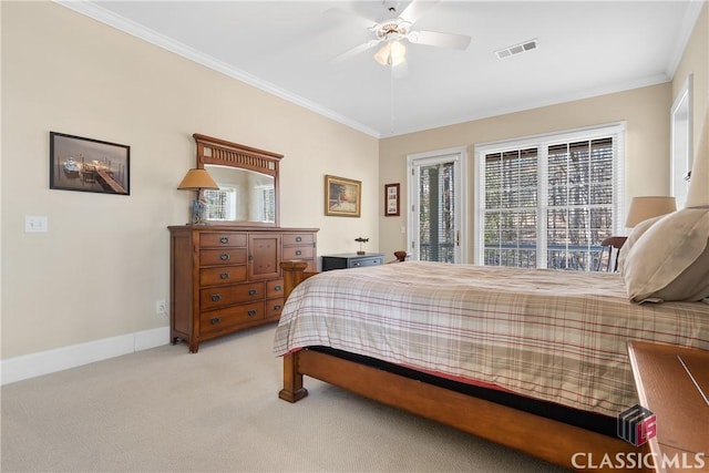 bedroom featuring light carpet, access to exterior, baseboards, visible vents, and ornamental molding