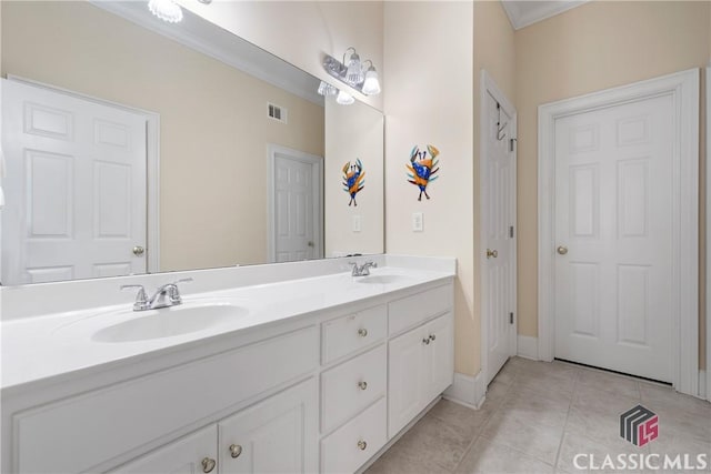bathroom with double vanity, a sink, tile patterned flooring, and visible vents