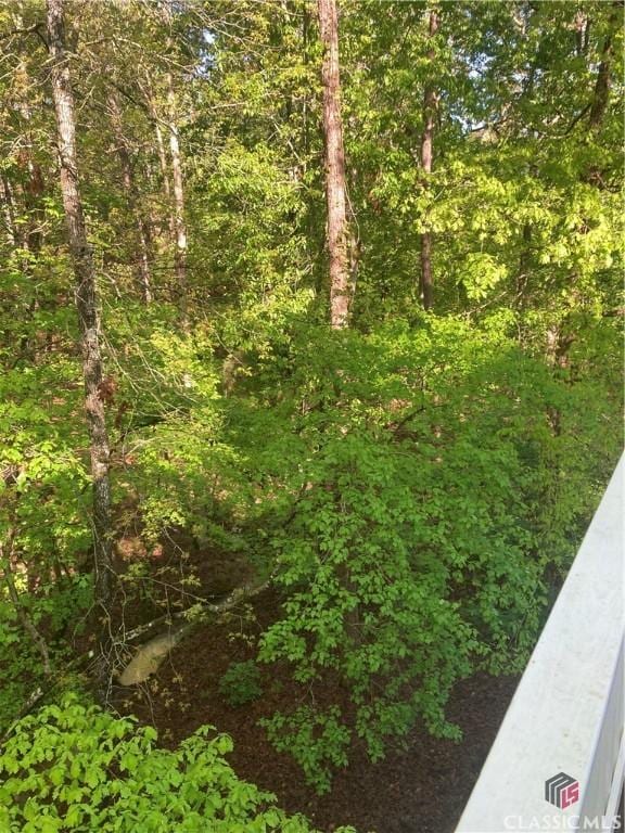 view of landscape with a forest view