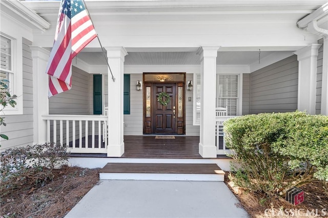 doorway to property with covered porch