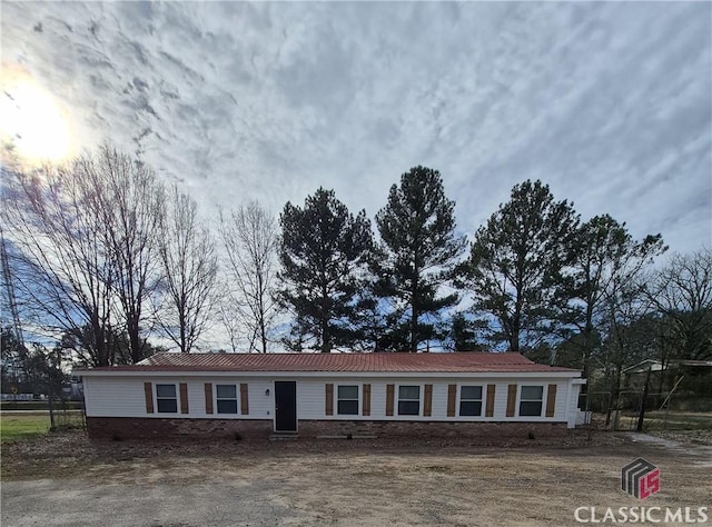 ranch-style house with metal roof