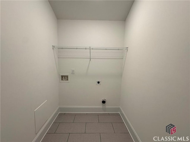 laundry room featuring hookup for a washing machine, electric dryer hookup, tile patterned flooring, laundry area, and baseboards