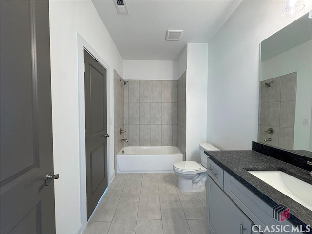 full bathroom featuring toilet, bathtub / shower combination, visible vents, and vanity