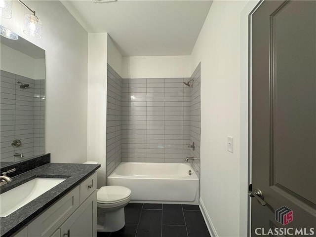 bathroom with toilet, tile patterned flooring, shower / washtub combination, and vanity