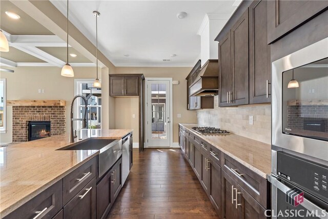 1380 Melody Bnd Unit 45, Watkinsville, GA 30677 - kitchen featuring appliances with stainless steel finishes, a sink, plenty of natural light, and dark brown cabinetry