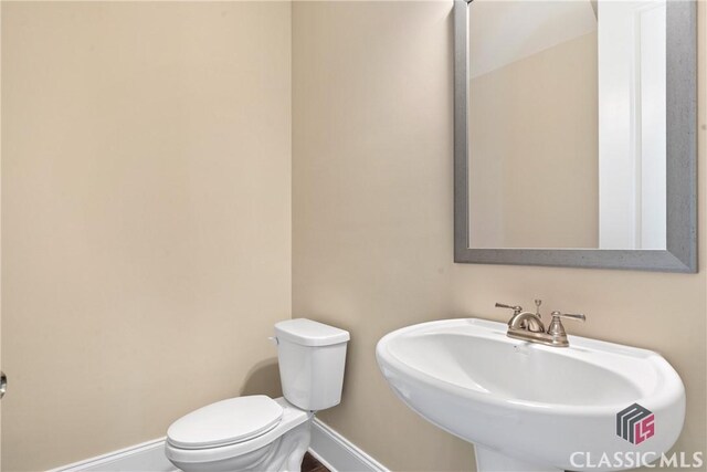 1380 Melody Bnd Unit 45, Watkinsville, GA 30677 - half bathroom with toilet, a sink, and baseboards