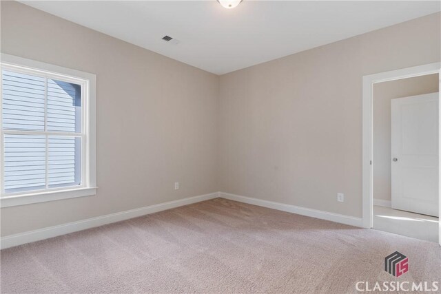 1380 Melody Bnd Unit 45, Watkinsville, GA 30677 - spare room with visible vents, baseboards, and light colored carpet