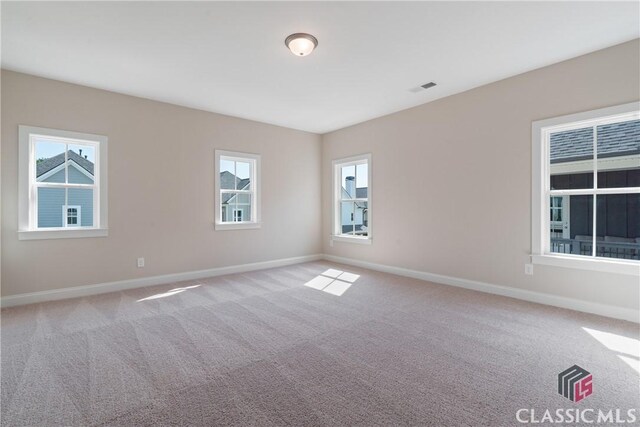 1380 Melody Bnd Unit 45, Watkinsville, GA 30677 - spare room featuring visible vents, baseboards, and carpet flooring