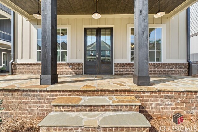 1380 Melody Bnd Unit 45, Watkinsville, GA 30677 - entrance to property with board and batten siding, french doors, and brick siding
